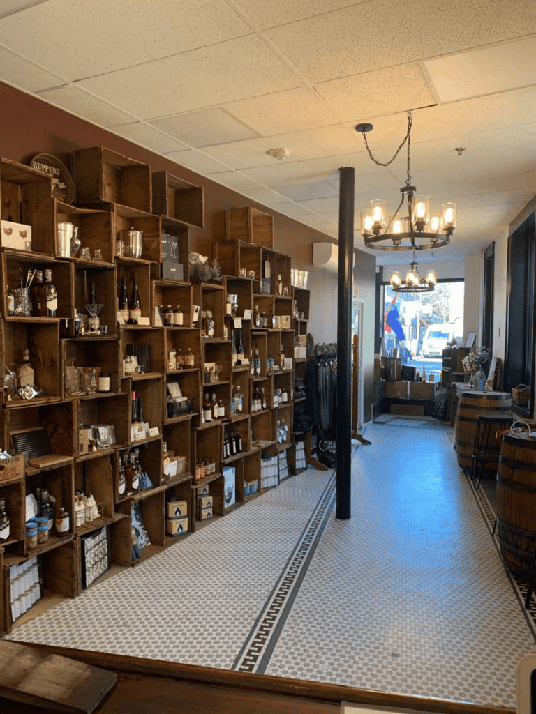 Artisan shop interior with wooden shelves and decorative lighting for unique quality products.