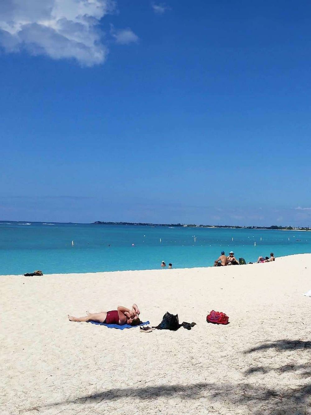 Relaxing beach scene with turquoise water and sandy shores, perfect for travel and vacation inspiration.