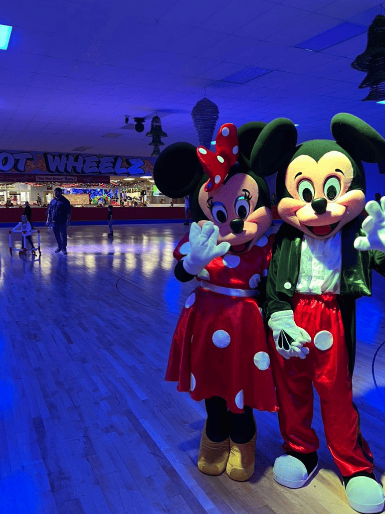 Colorful Disney characters Minnie Mouse and Mickey Mouse at Quest for Directions indoor amusement park.