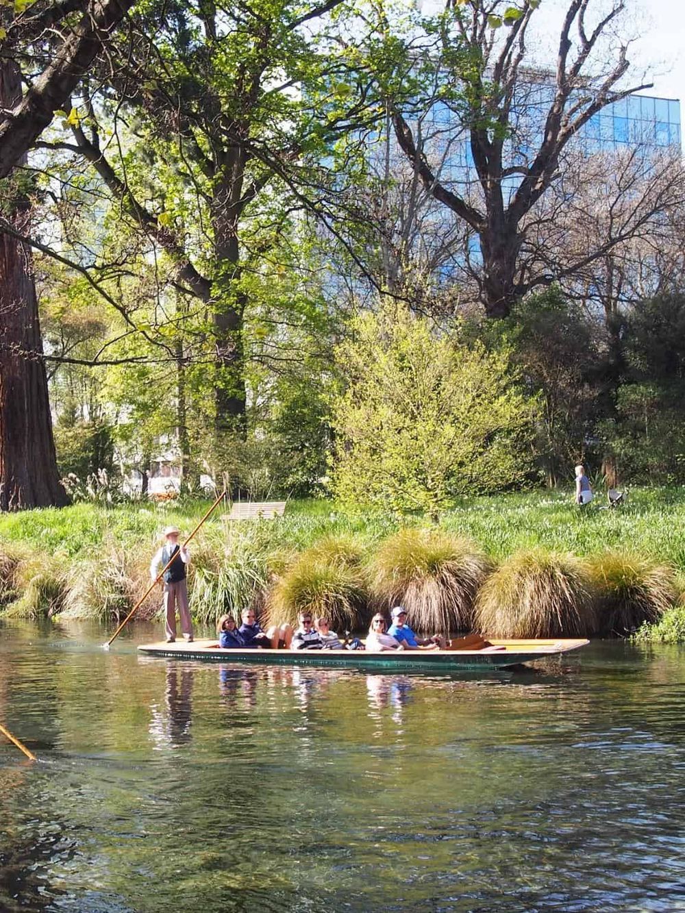 Serene boat ride in a lush park with trees and greenery, ideal for outdoor recreation and nature exploration.