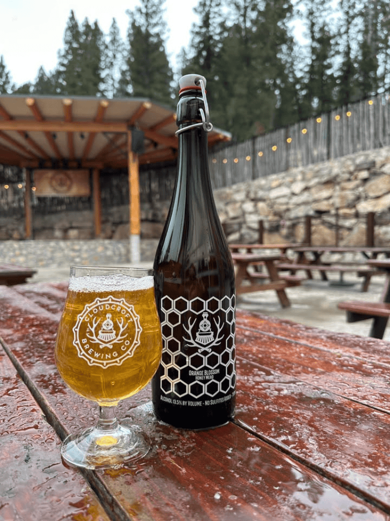 Crisp honey mead beer from Cloudbreak Brewing Co at an outdoor patio setting.