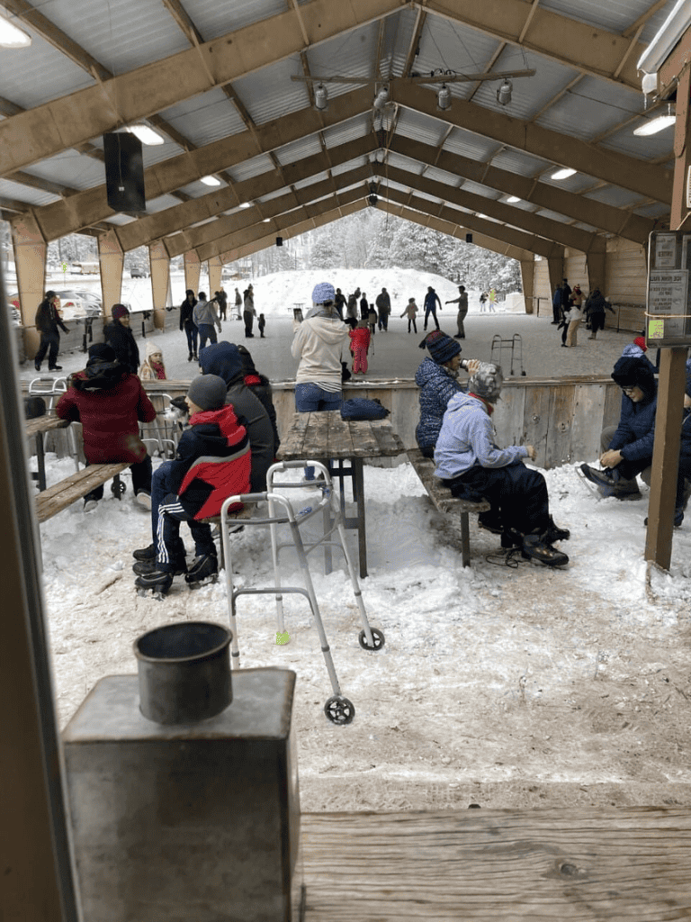 Snow tubing park at QuestForDirections with families enjoying winter activities.