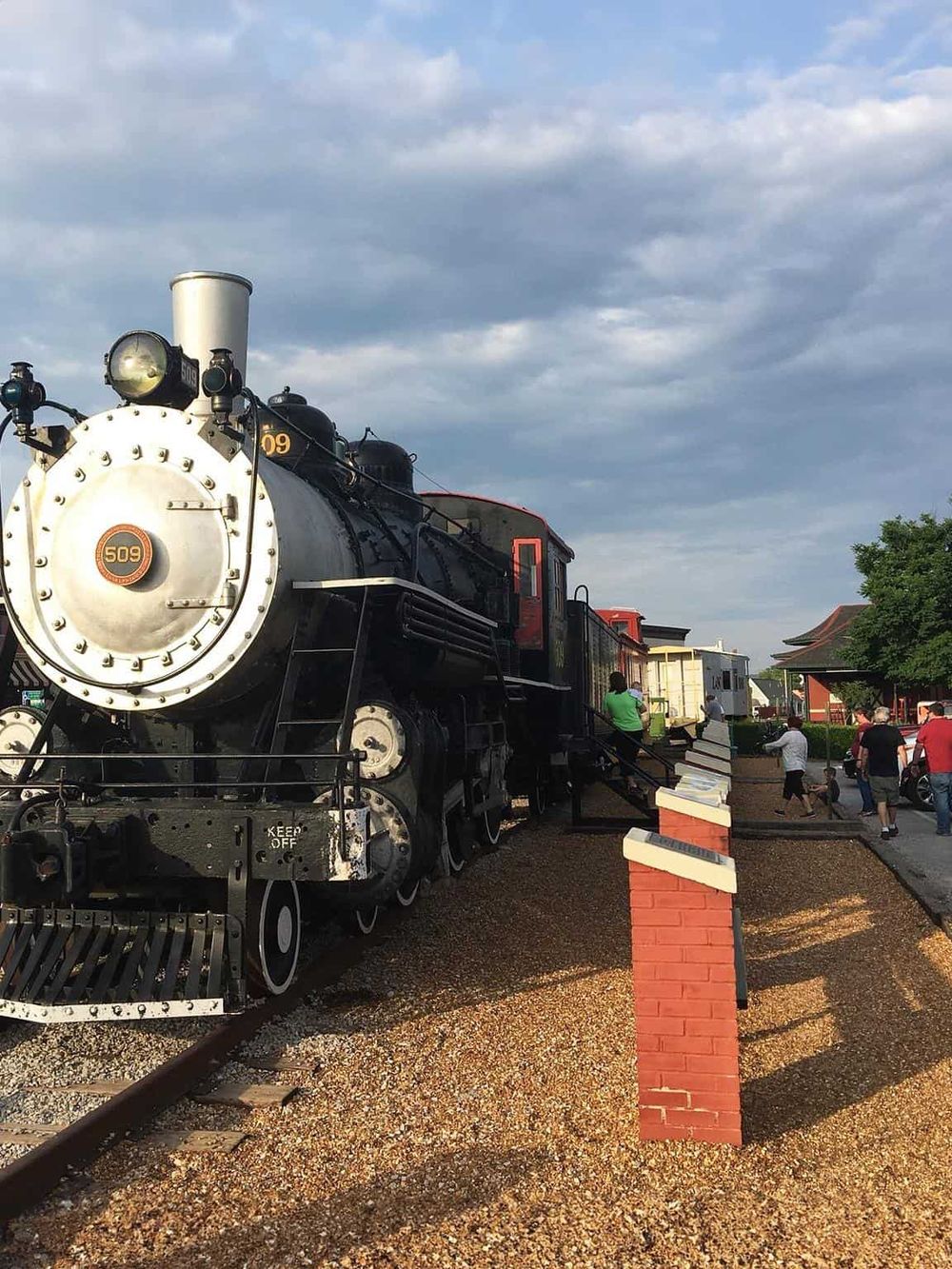 Vintage steam locomotive train at a historical train station, popular for sightseeing and travel adventures.