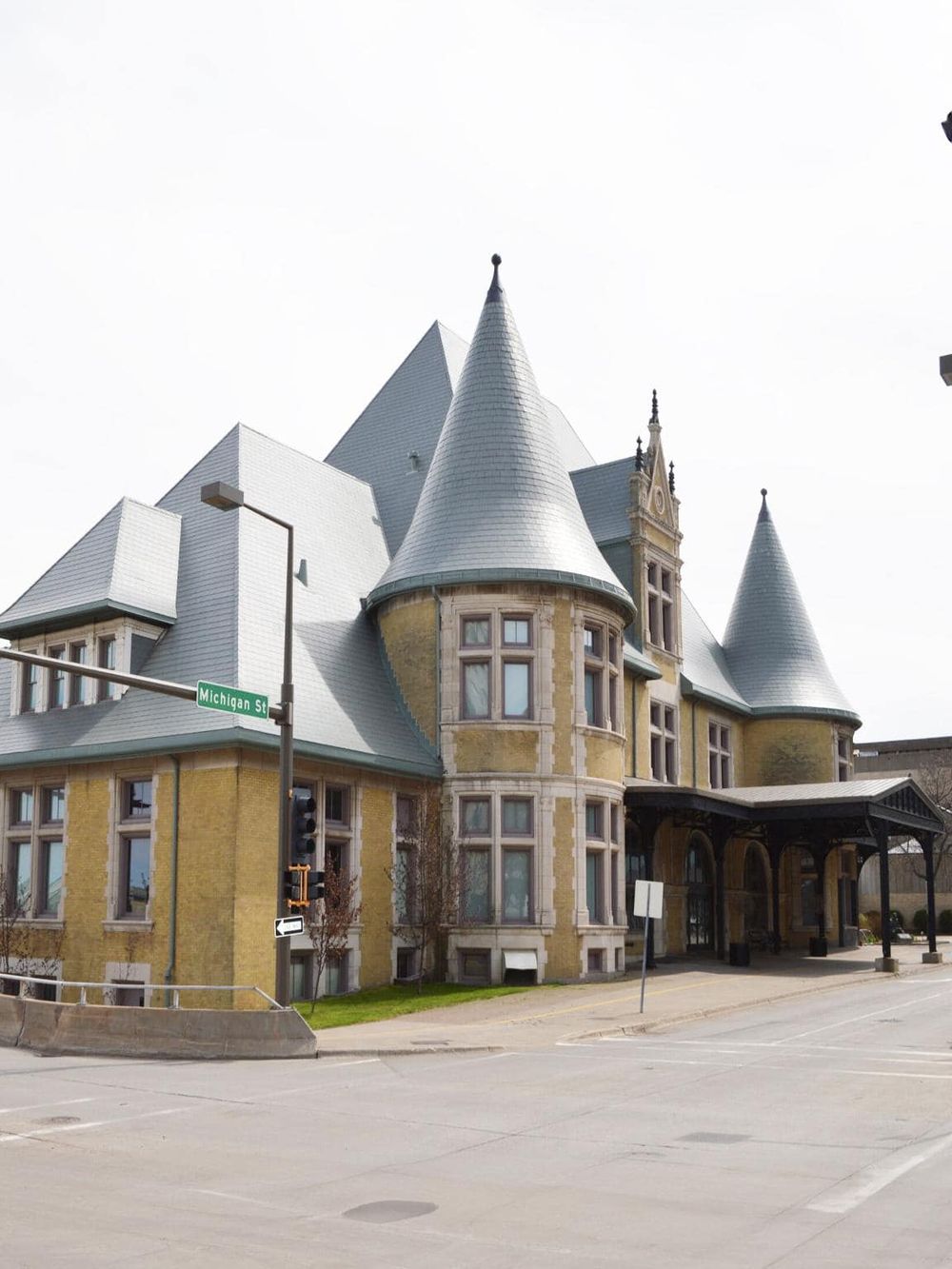 Fairy tale castle building with turrets and stone accents, located on Michigan Street, USA.