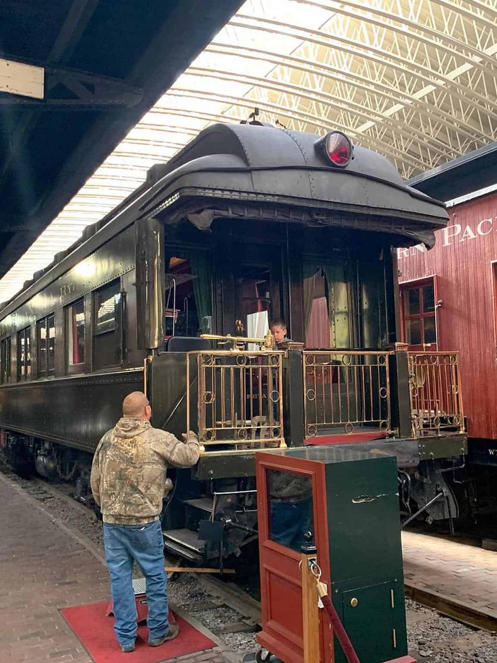 Vintage train carriage at themed museum or exhibit, showcasing historical railway transportation.