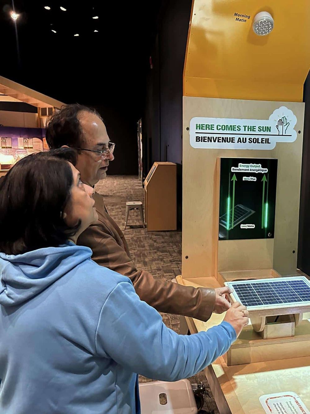 Solar energy engagement exhibit at QuestForDirections, promoting renewable energy awareness.