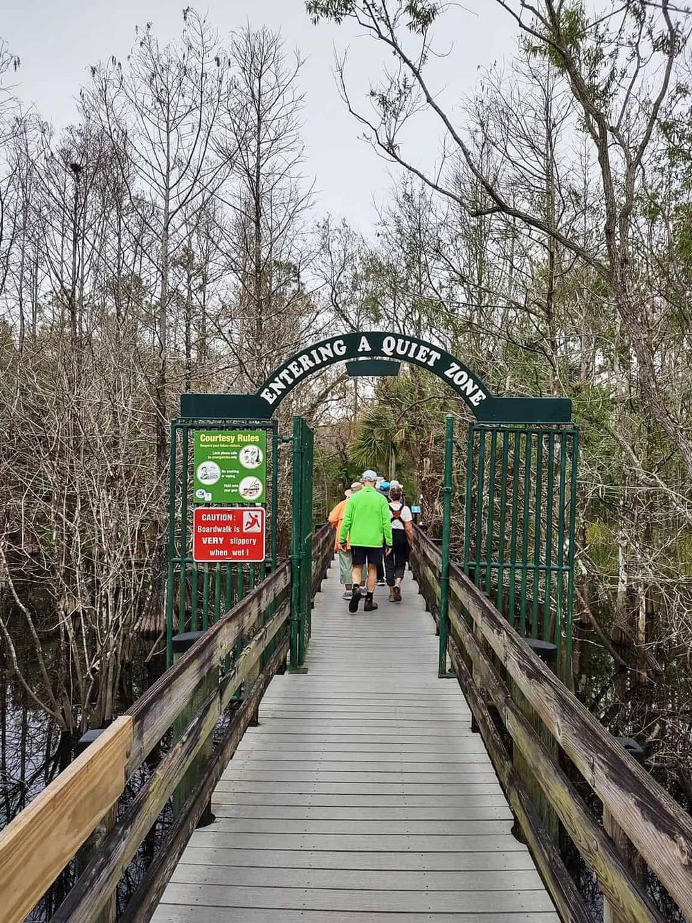 Quiet zone entrance with wooden walkway surrounded by nature, ideal for peaceful outdoor exploration.