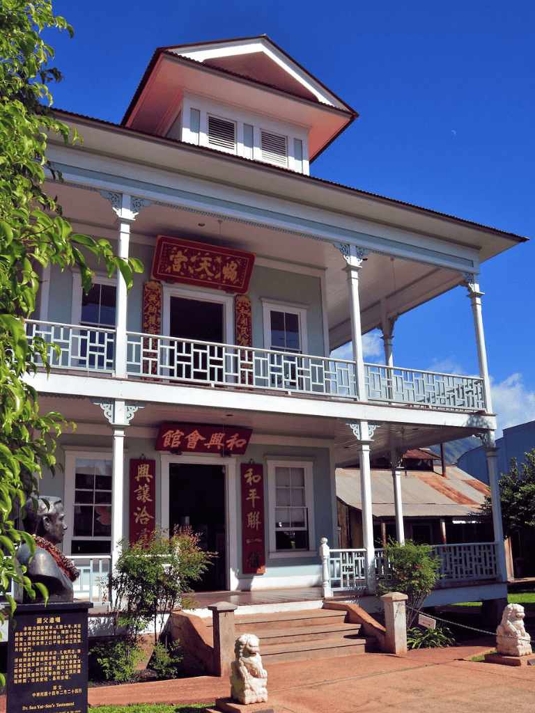 Old Chinese-style architecture building with balcony and traditional decorations, popular for historical and cultural tourism.
