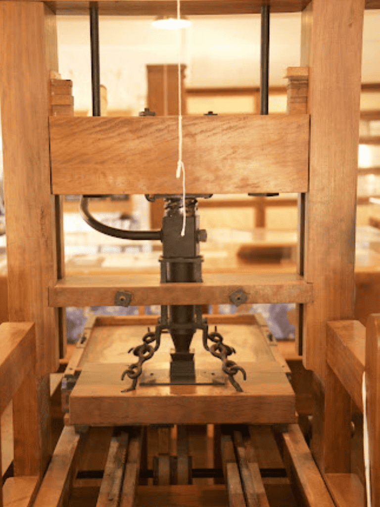 Antique wooden loom machinery used in traditional weaving processes.
