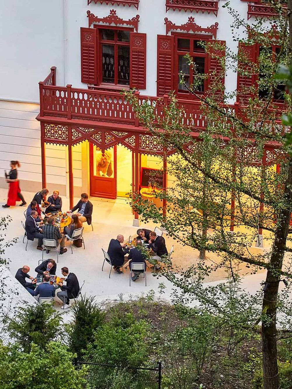 Beautiful courtyard dining at QuestForDirections restaurant with outdoor seating and traditional architecture.