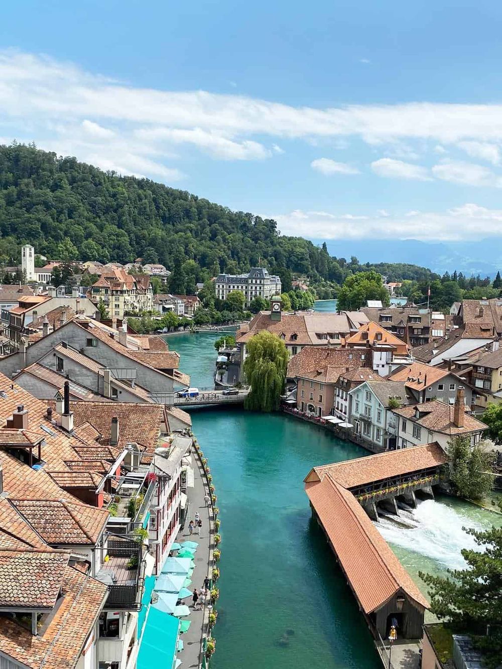 Charming riverside town with historic architecture and scenic mountain views, perfect for travel and adventure.