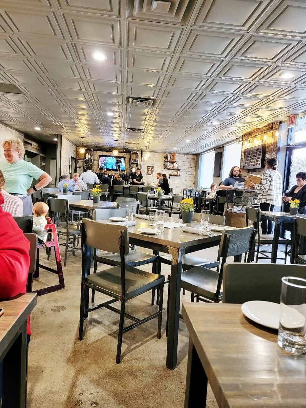 Cozy restaurant interior with modern decor and lively atmosphere, ideal for dining out and enjoying meals with friends and family.