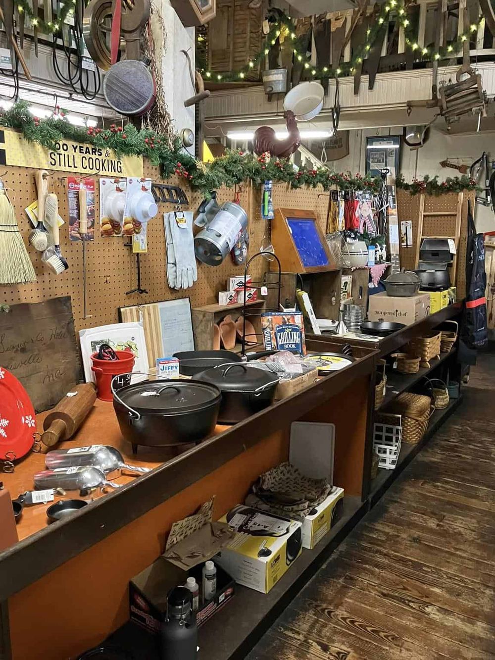 Rustic thrift store with vintage kitchenware and holiday decor, ideal for unique home accessories and gifts.