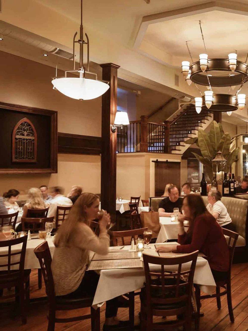 Warm and inviting restaurant interior with elegant lighting, perfect for dining experiences.