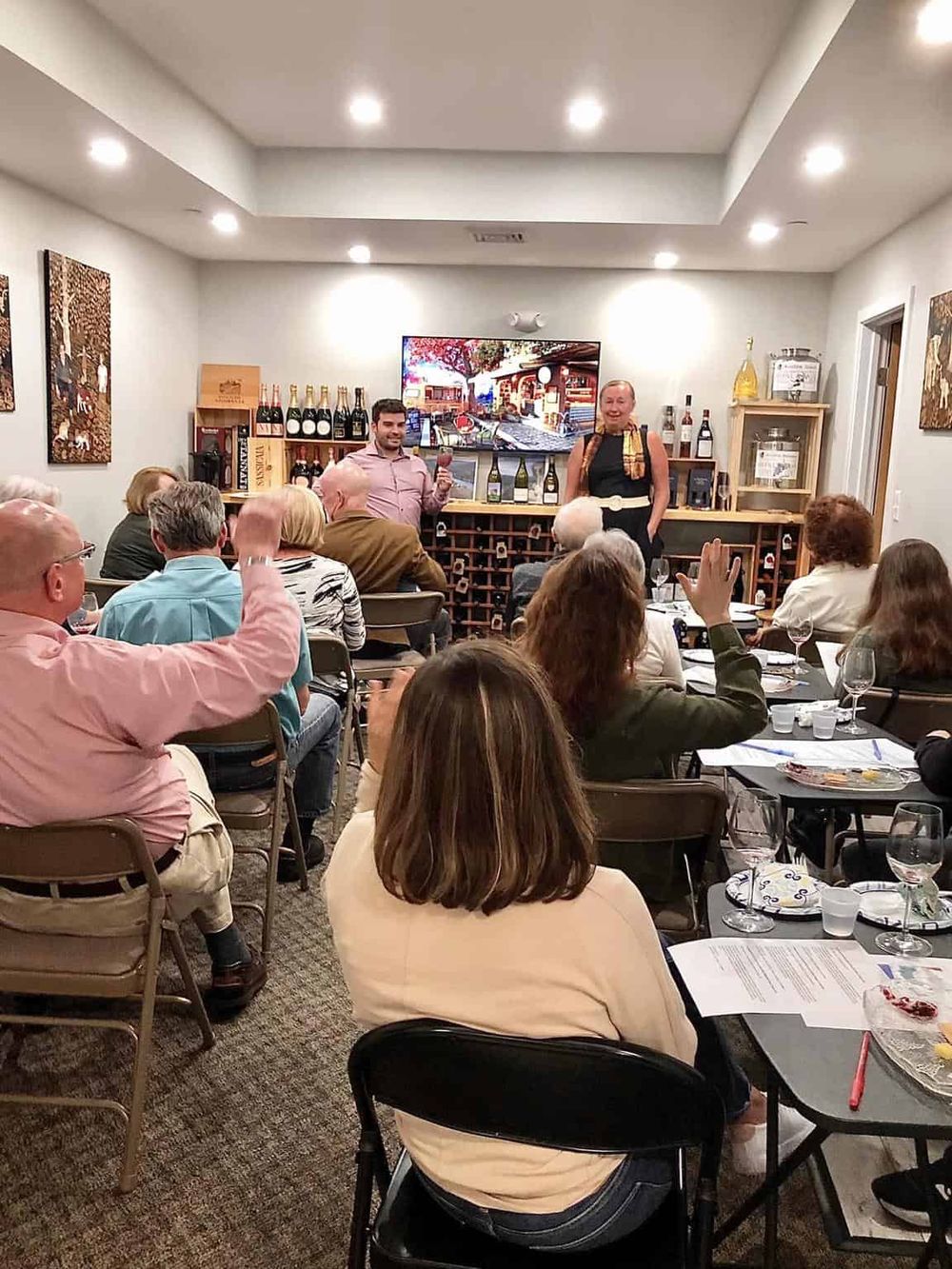 Wine tasting event at Quest For Directions, showcasing a lively atmosphere.