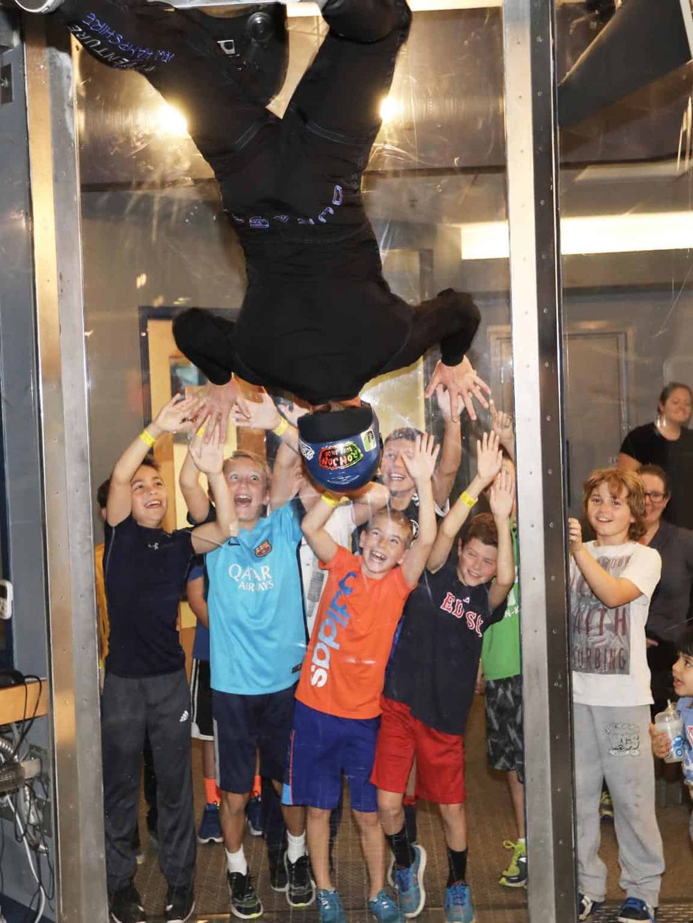 1. Kids enjoying indoor skydiving experience in a vertical wind tunnel.