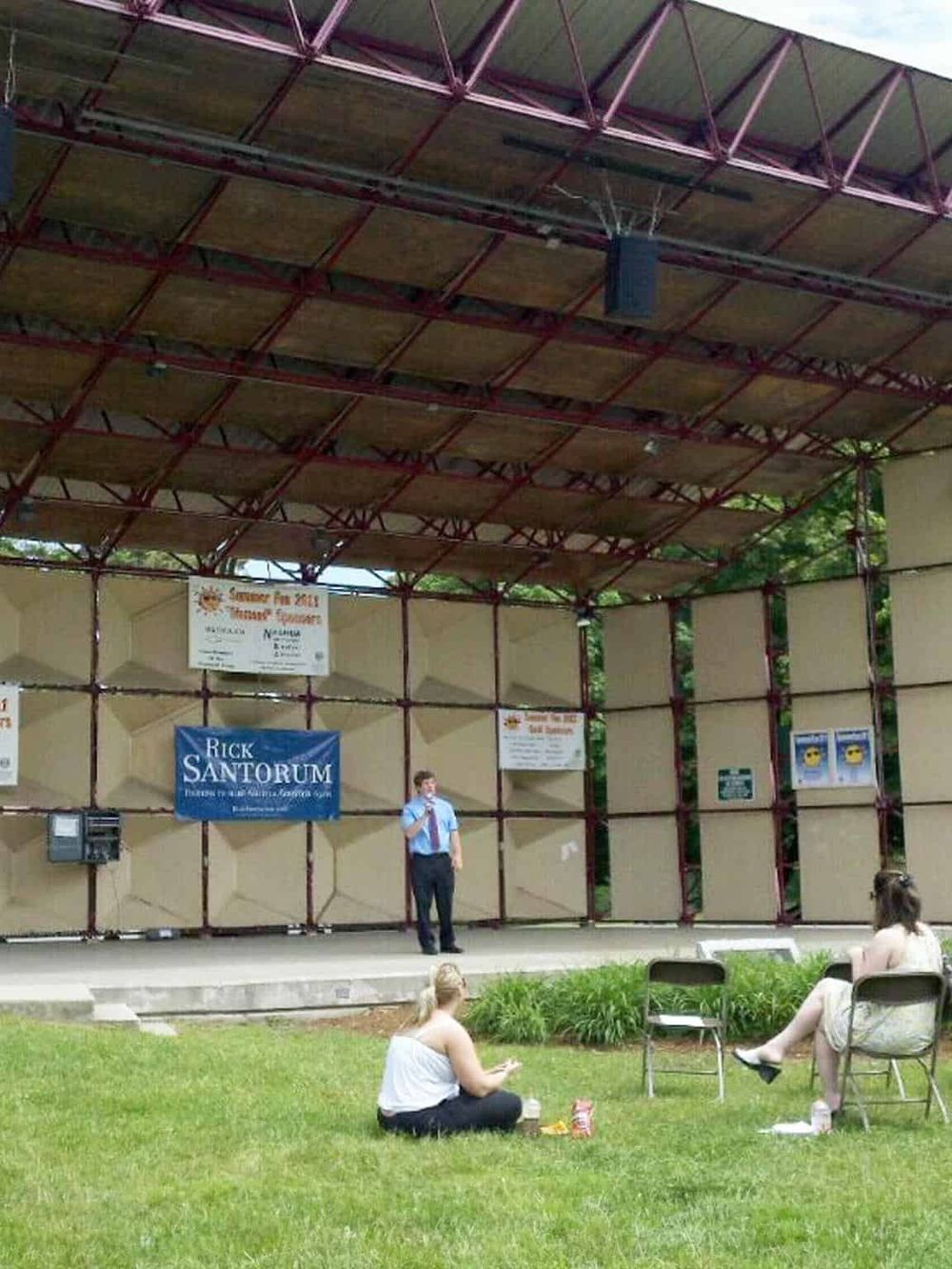 Audience engaging outdoor event by Quest for Directions featuring speaker Rick Santorum.