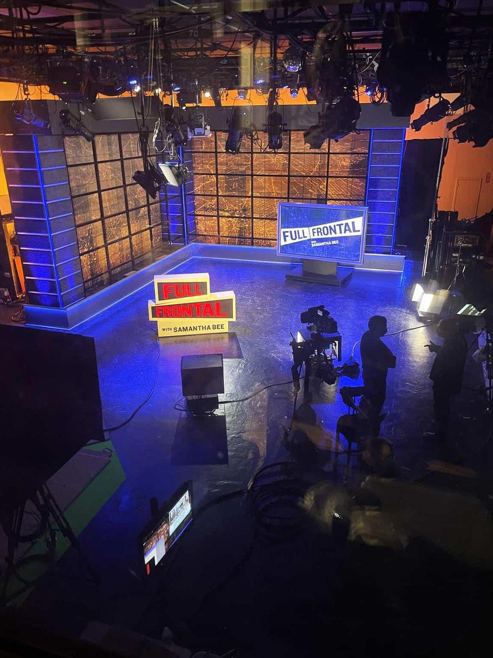 Broadcast studio setup for "Full Frontal with Samantha Bee" TV show, featuring lighting and camera equipment.