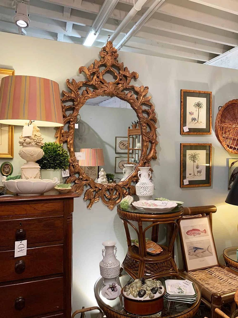 Intricate vintage mirror and antique decor in a stylish home accessories store.