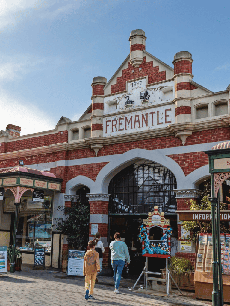 Fremantle public market historic building with visitors, vibrant shopping and local crafts.
