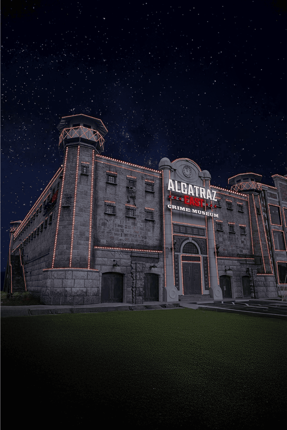 Dark night scene of Alcatraz East Crime Museum with illuminated outline and starry sky in the background.