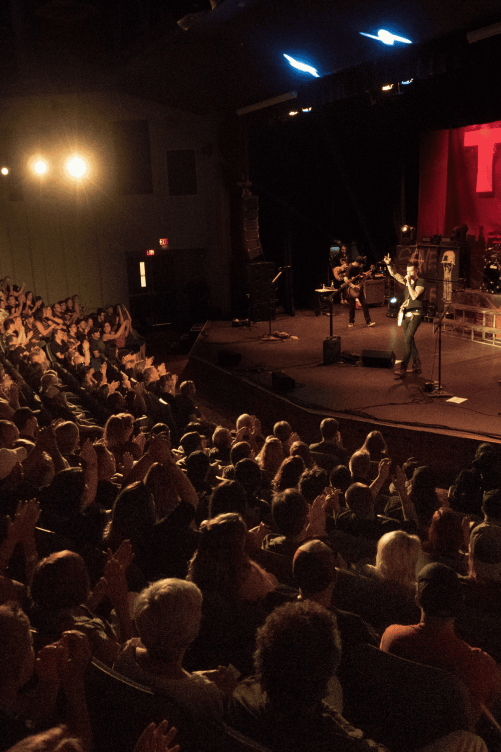 1. Live concert performance with audience in a theater.