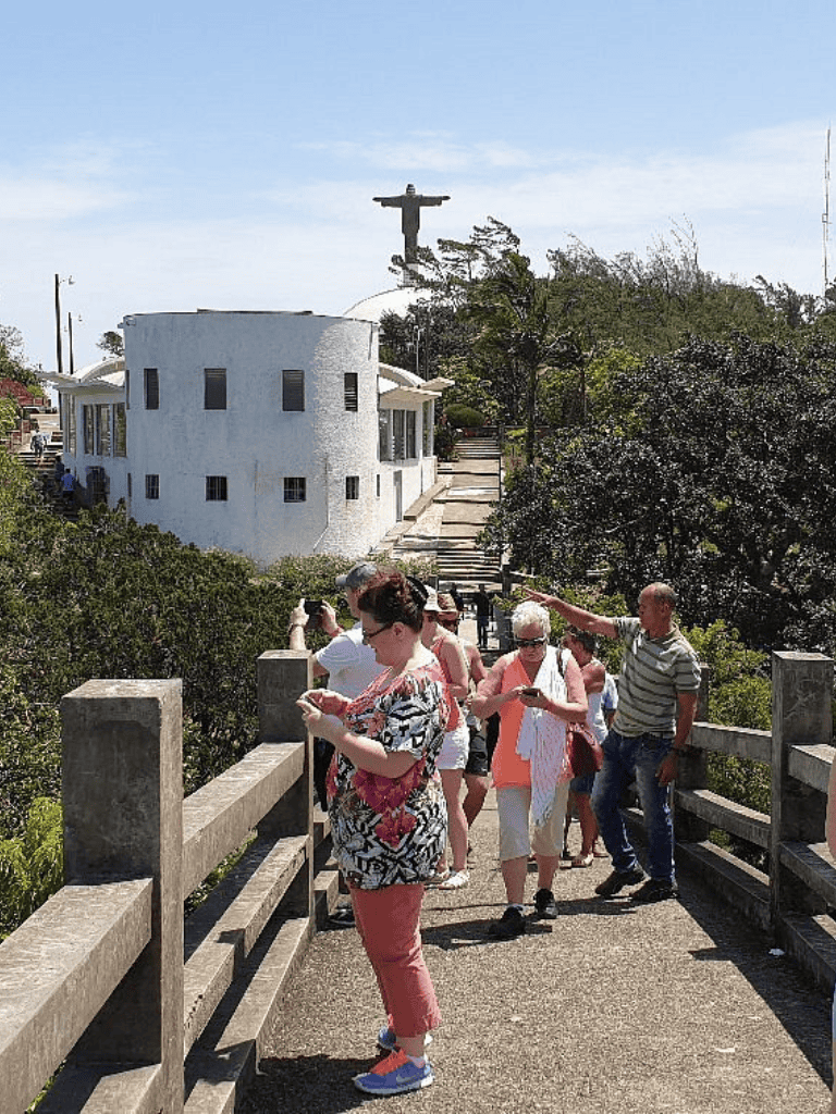 Historic church Tourists using mobile devices at Mission Dolores San Francisco.