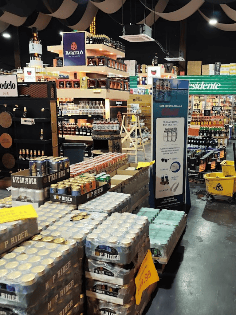 Steam brew canned beverages and alcohol products in a retail store aisle.