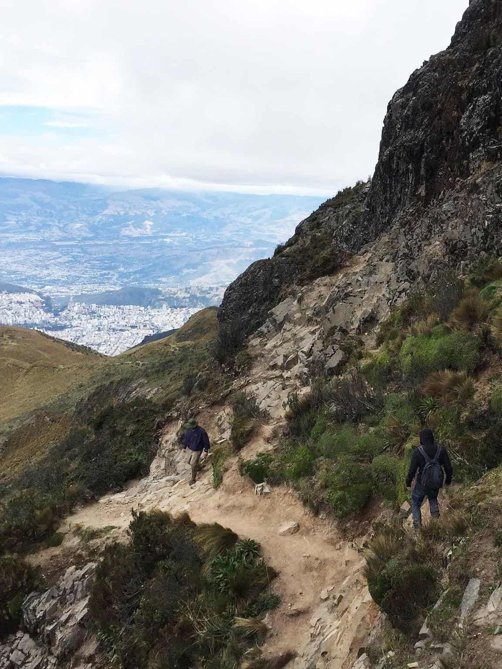 Steep mountain trail hikers with backpack scenic outdoor adventure Nature exploration.