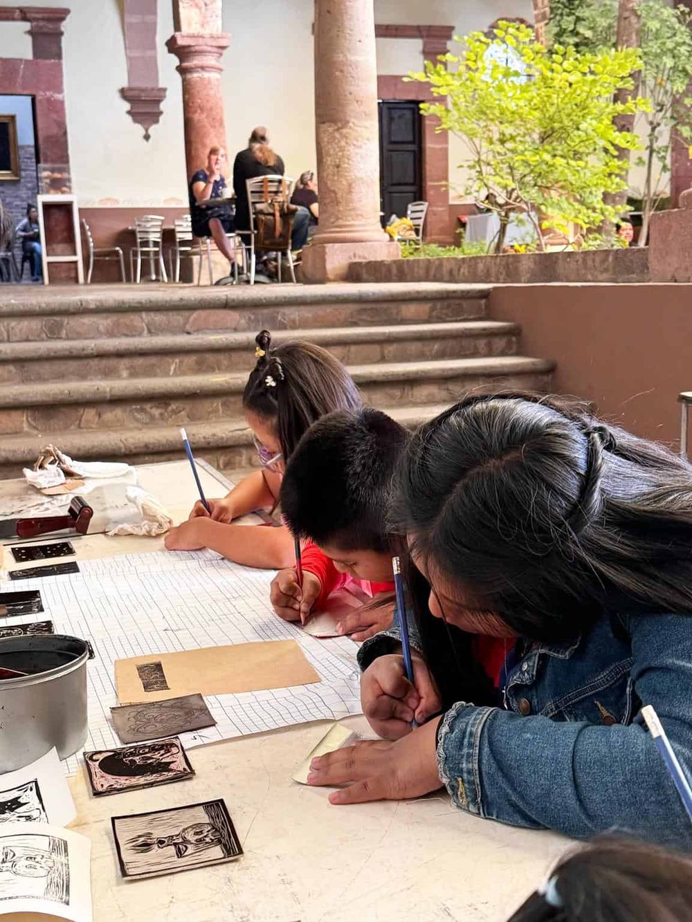 Children engaging in creative art activity at QuestForDirections event, fostering artistic expression and community connection.