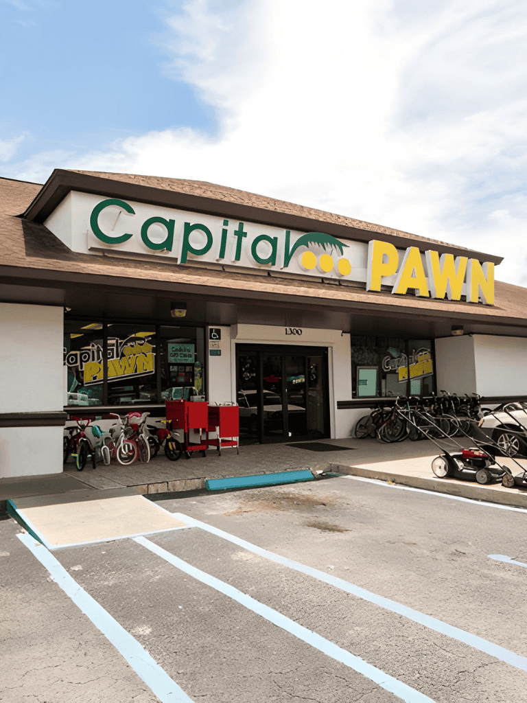 Capitol Pawn storefront with bikes and parking lot, retail shopping location in the USA.