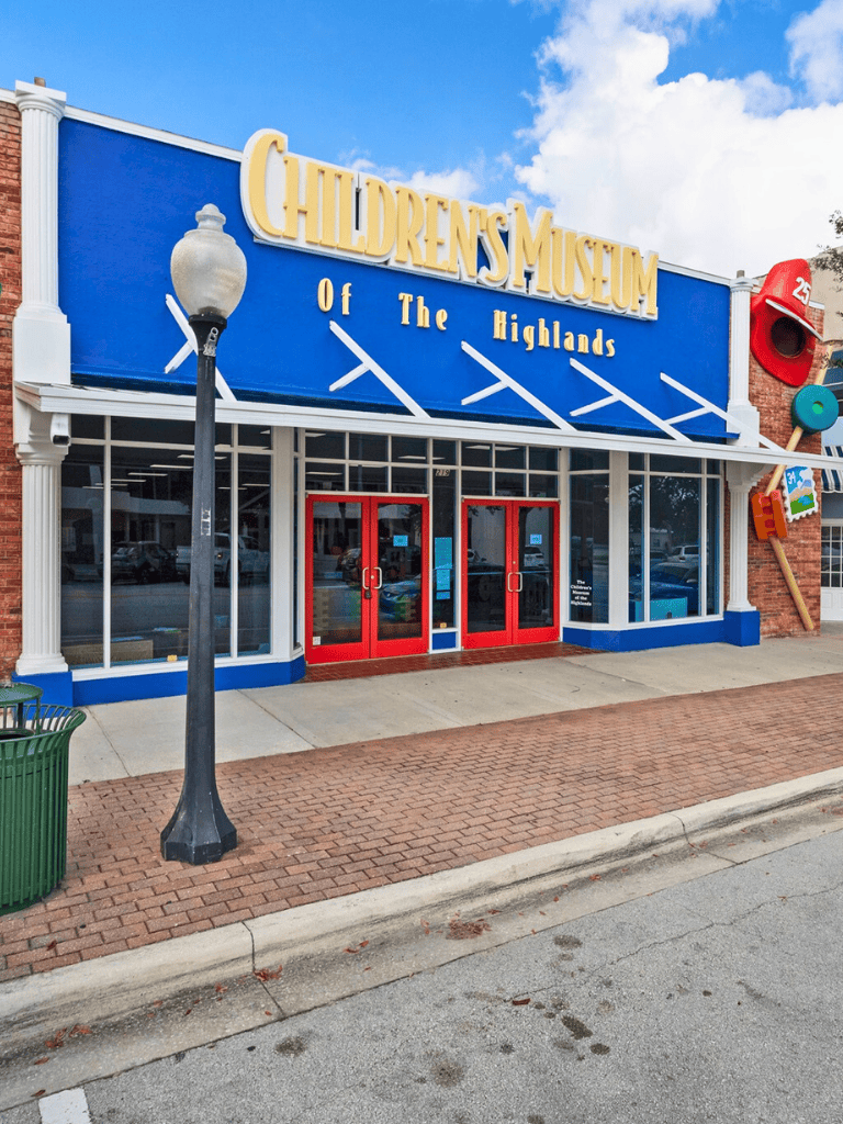 Children's Museum of The Highlands exterior entrance with bright signage and red doors, ideal for family outings, educational fun.
