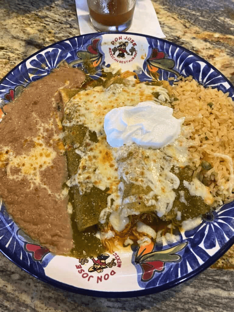 Fresh Mexican dish with rice, beans, cheese, and sour cream at Don Jose Mexican Restaurant, vibrant food presentation.