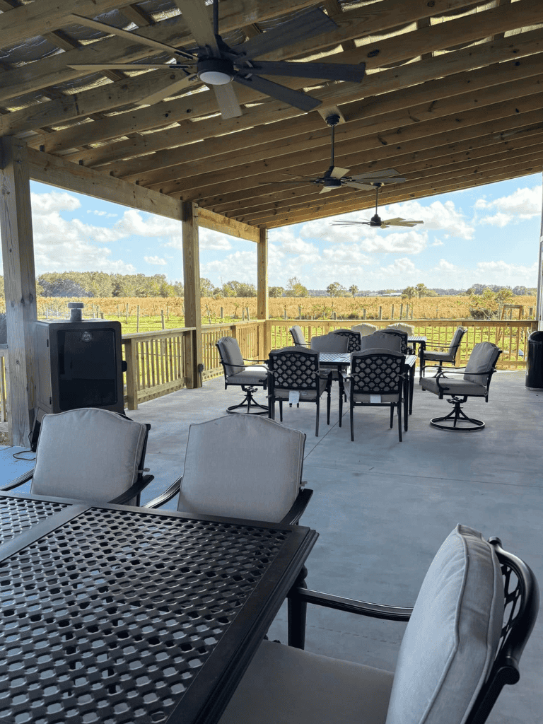 Outdoor event space with covered patio and scenic rural views, ideal for gatherings at QuestForDirections.