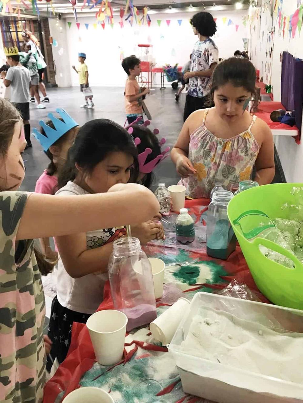 Colorful children's party with crafts, decorations, and joyful kids engaging in fun activities at QuestForDirections.