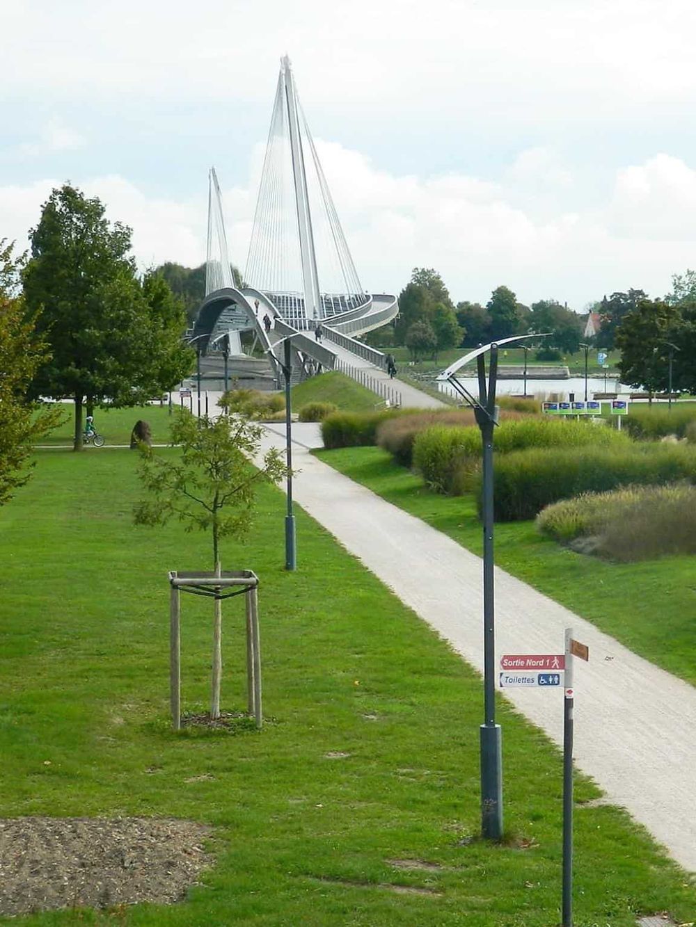 Modern park with innovative bridge and scenic pathways in QuestForDirections.