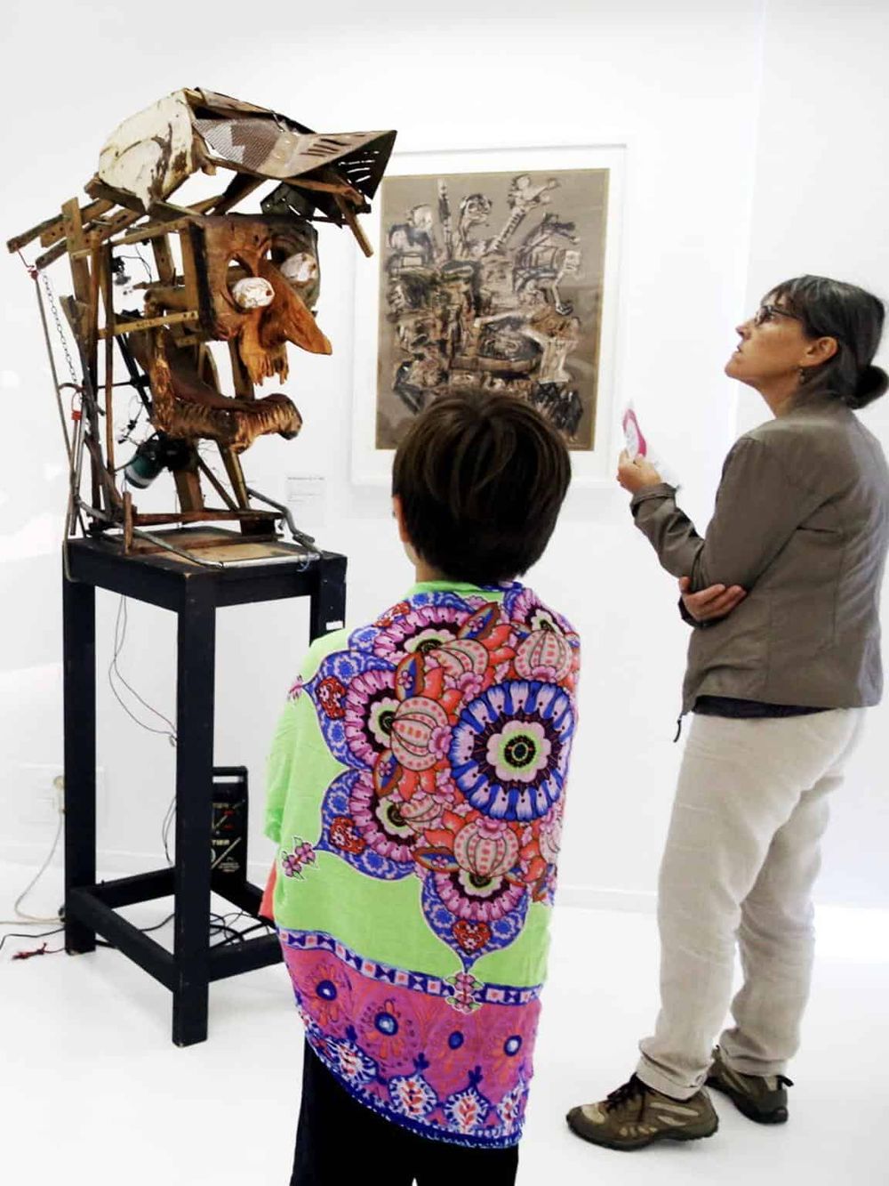 1. Outsider artwork sculpture at art gallery, modern art exhibit, creative sculpture in white gallery space.