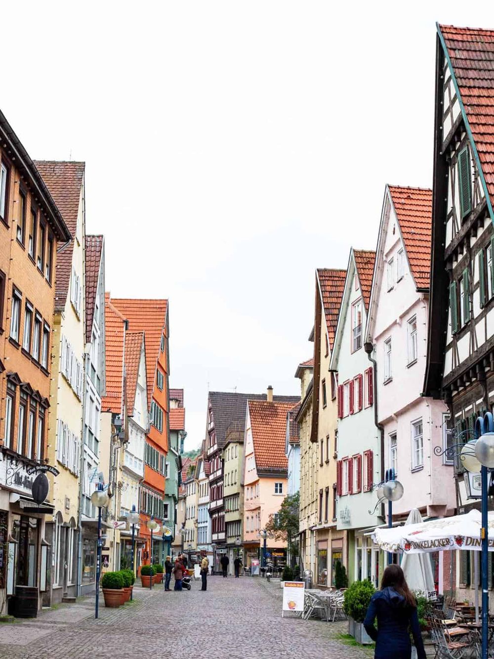 Colorful European street with quaint shops and cafes, ideal for travel guides and tourism SEO.