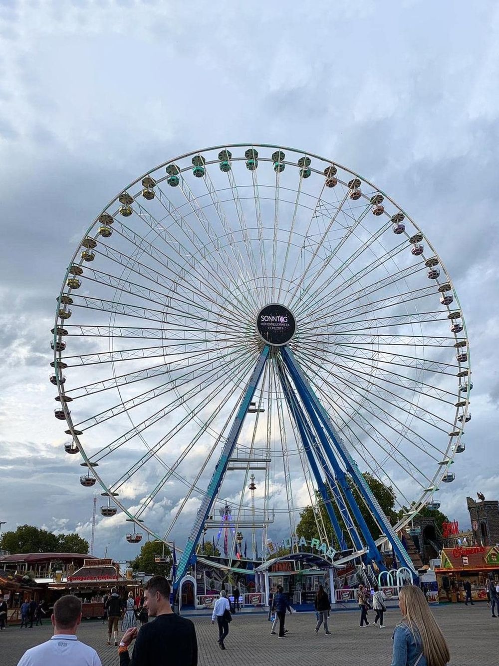 Large Ferris wheel at amusement park, popular for entertainment and family fun.