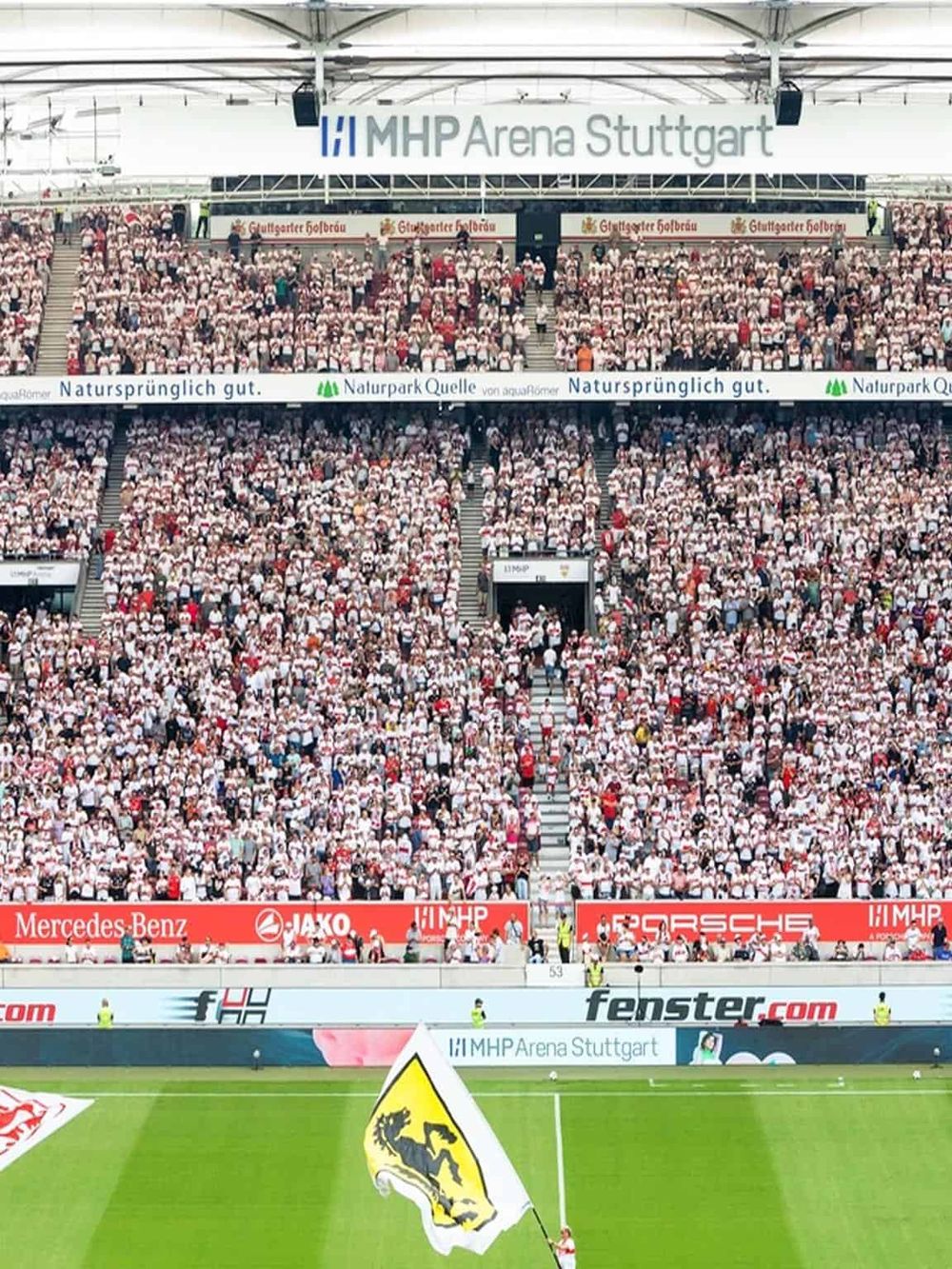 Crowd at MHP Arena Stuttgart during a sporting event, filled with fans and supporters.