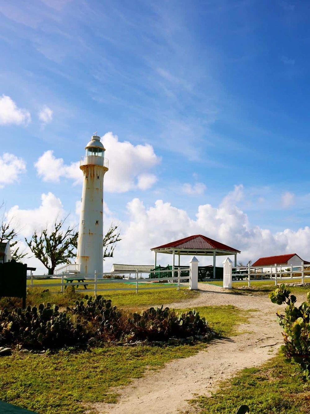 Rusty lighthouse with dive shelter, lookout point, and coastal views in Key West, Florida. Perfect for navigation and sightseeing.