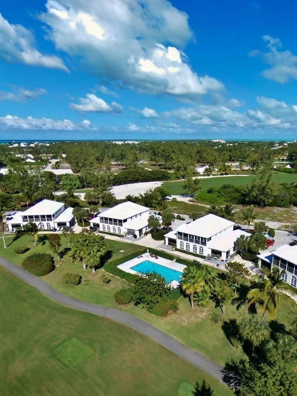 Beautiful neighborhood with pool access and lush greenery, ideal for luxury living and outdoor relaxation.