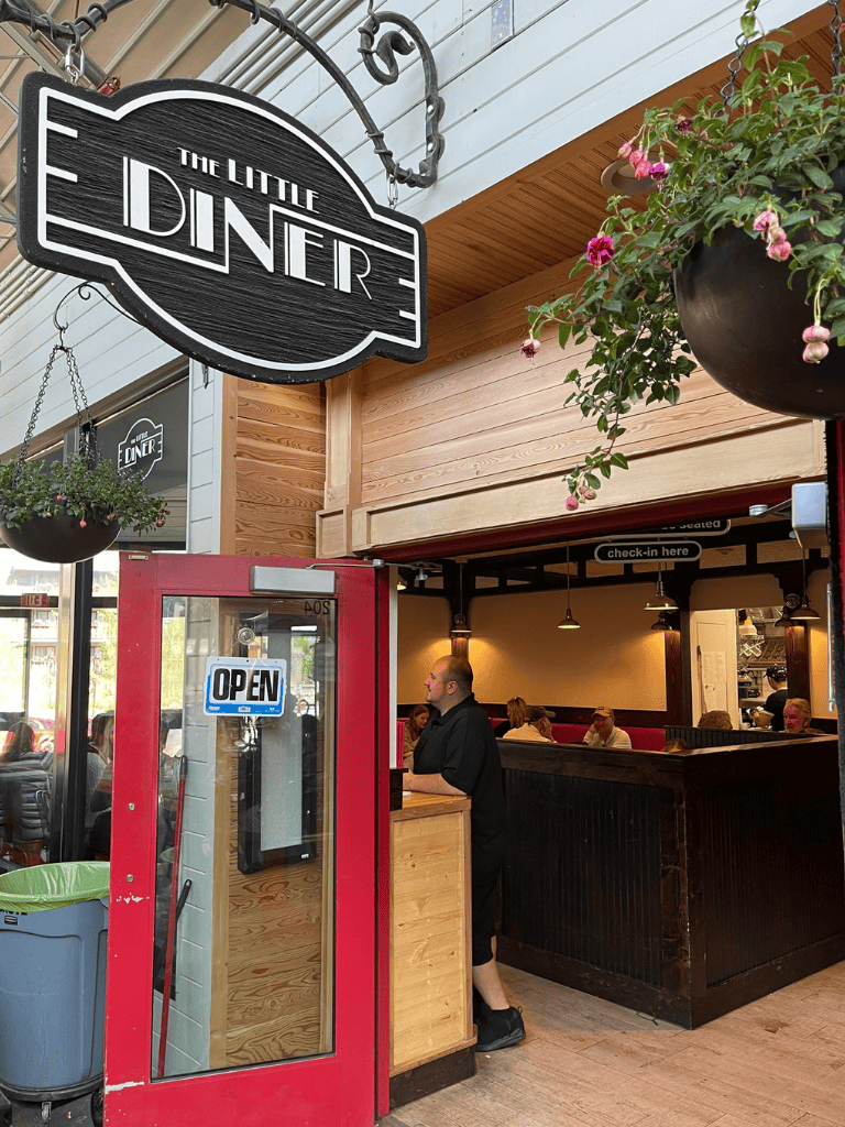 Fresh Diner interior with customers, check-in counter, and welcoming atmosphere for delicious meals.