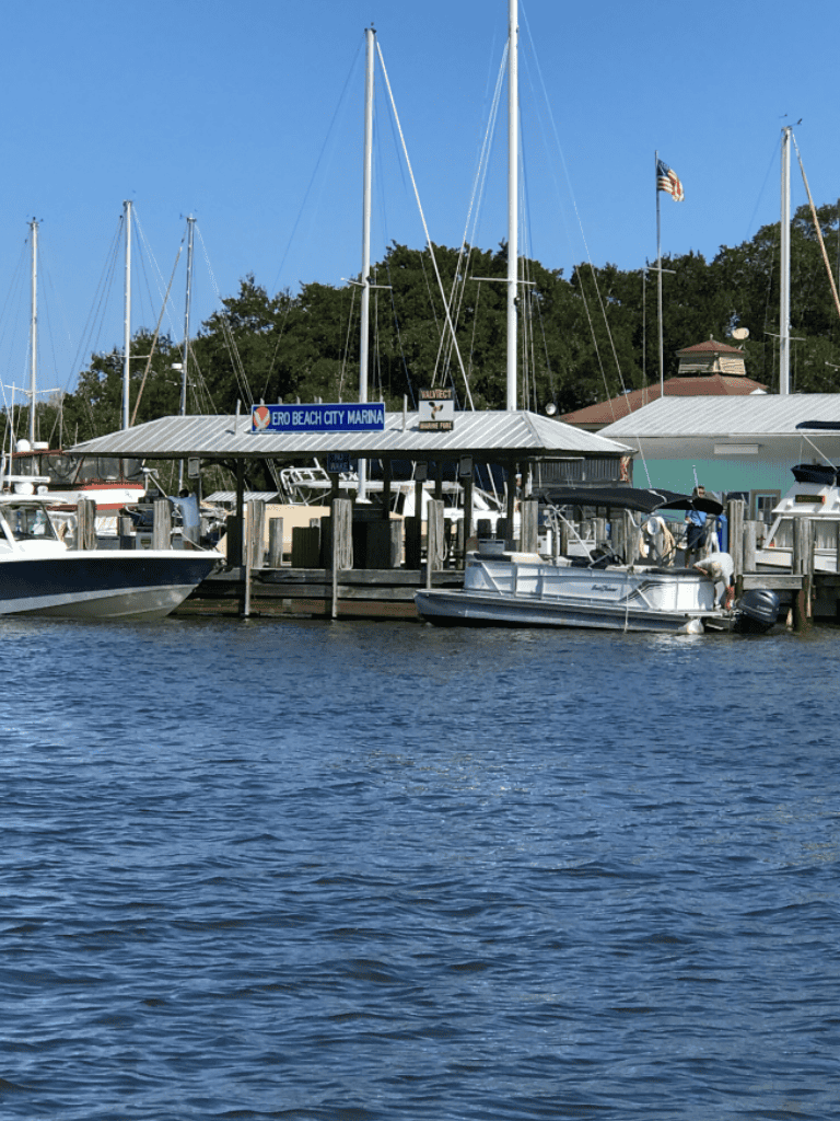 Boats docked at Ero Beach City Marina in a scenic waterfront setting.