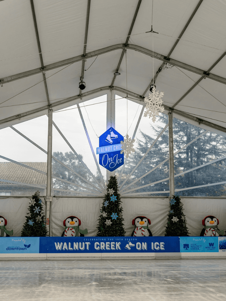 WALNUT CREEK ON ICE holiday winter skating rink indoor Christmas festive decor.