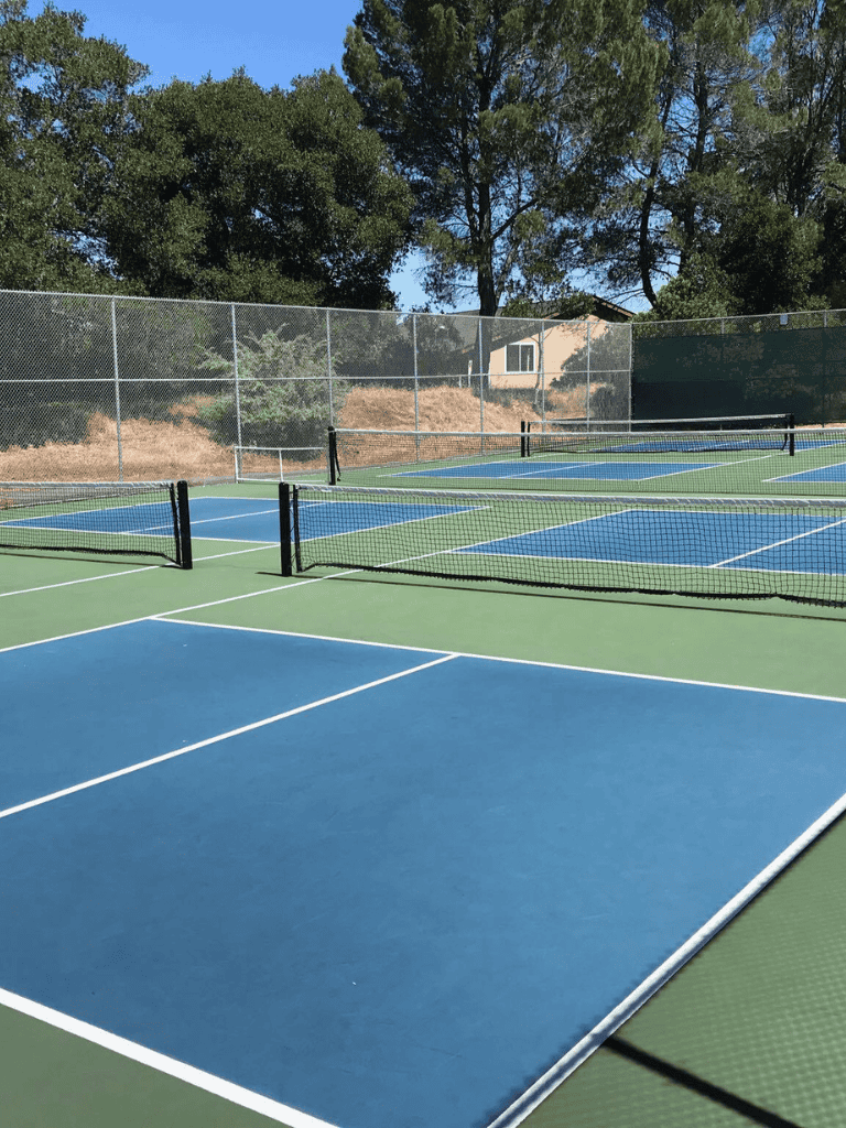 Multi-use tennis and pickleball courts at QuestForDirections outdoor sports complex.