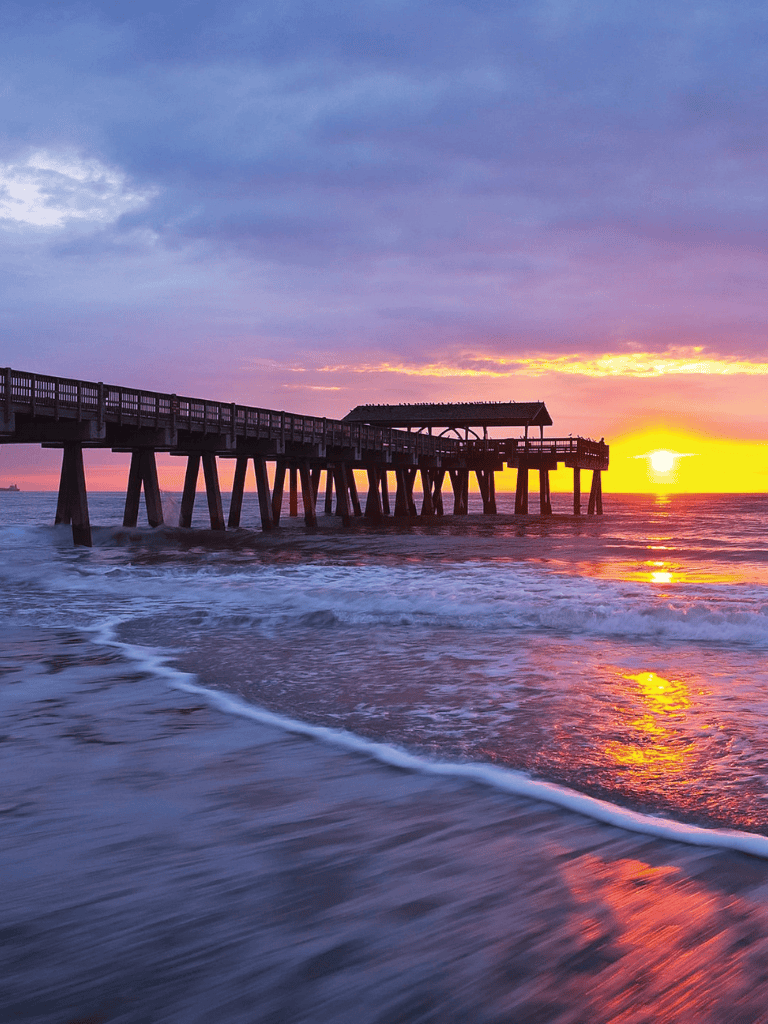 Sunset pier over ocean at dusk, travel, ocean view, sunset, seaside, beach, scenic, adventure, exploration, QuestForDirections.