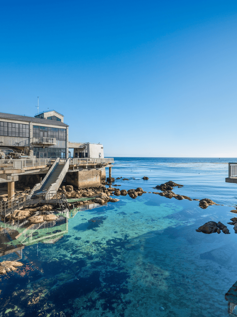 Stunning coastal scene at QuestForDirections with clear blue waters and seaside buildings.