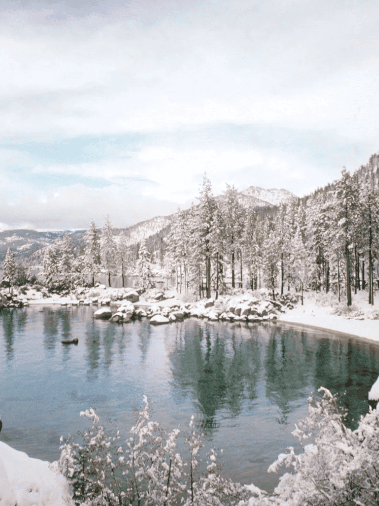 Snowy mountain river scenery in Colorado during winter or early spring.