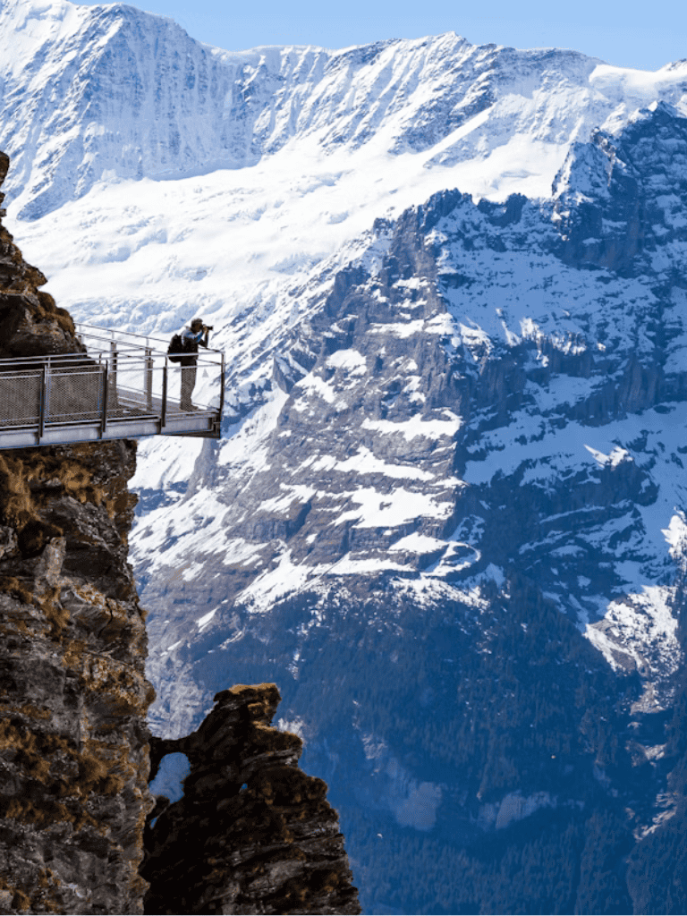 Spectacular mountain view with a glass observation deck in the Alps, offering breathtaking scenic experiences.